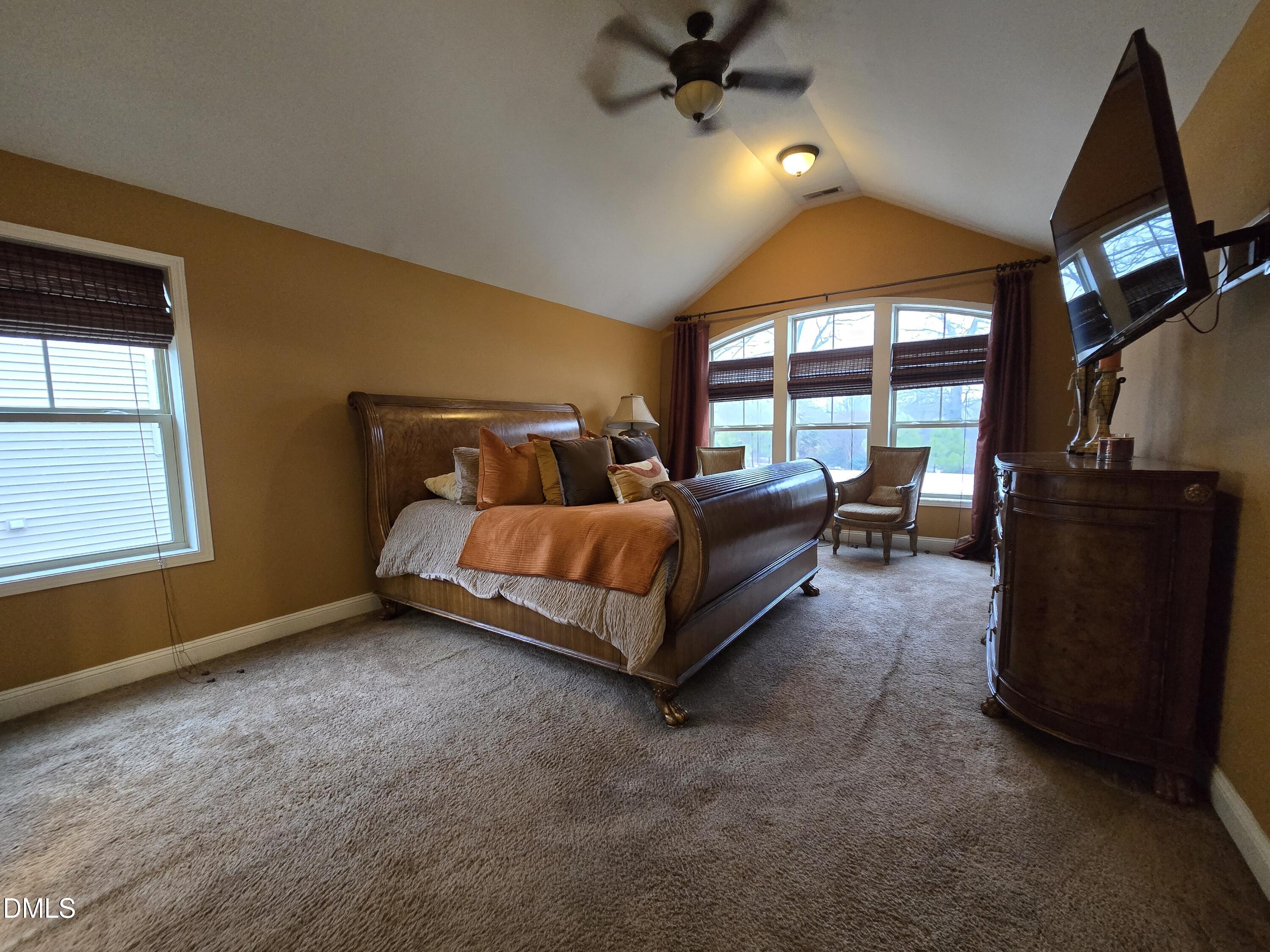 4202 Smithson Court Raleigh, NC 27616 - Photo 34 of 54 a bed room with a bed and a tv