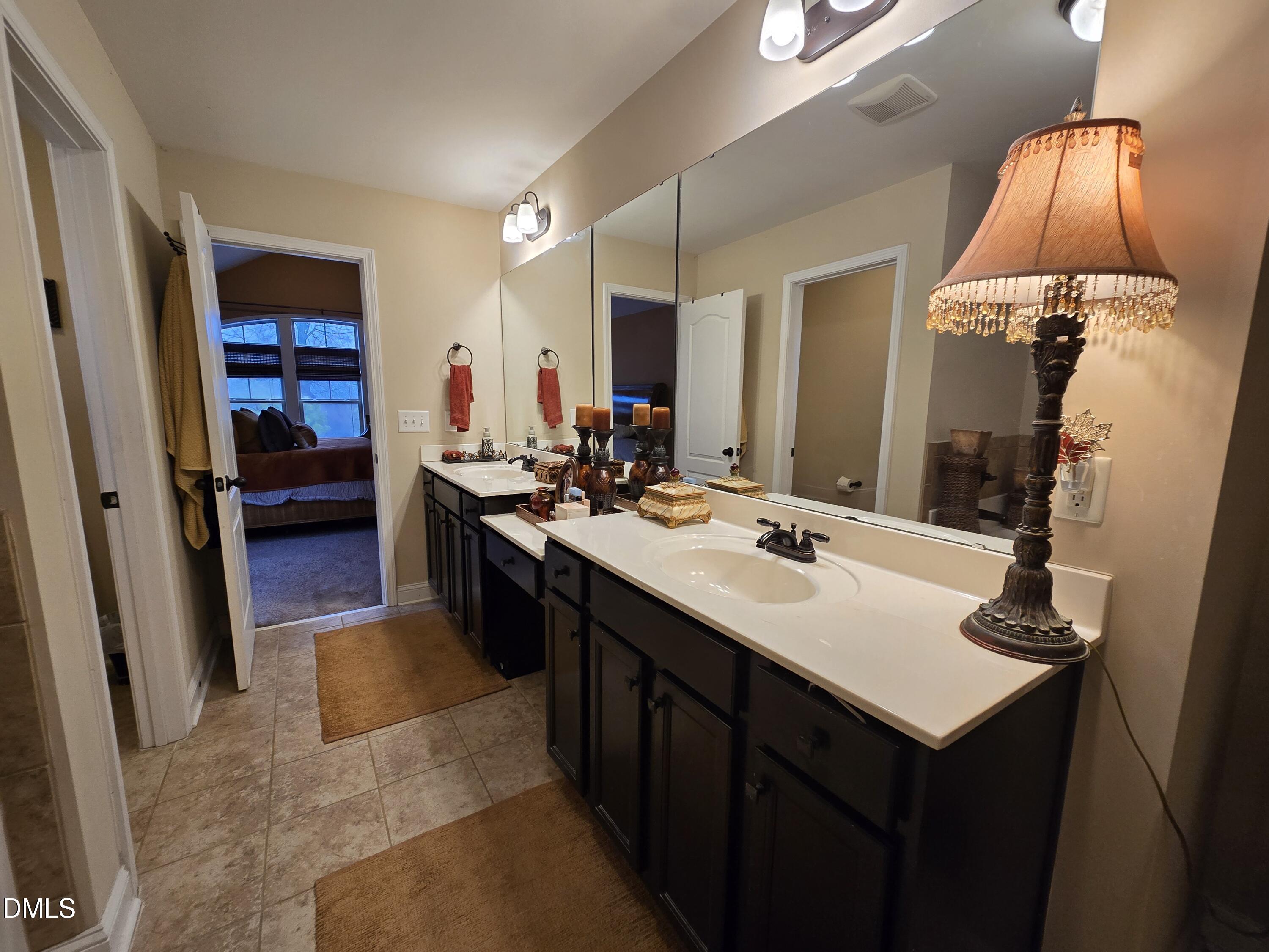 4202 Smithson Court Raleigh, NC 27616 - Photo 40 of 54 a kitchen with a sink and a refrigerator