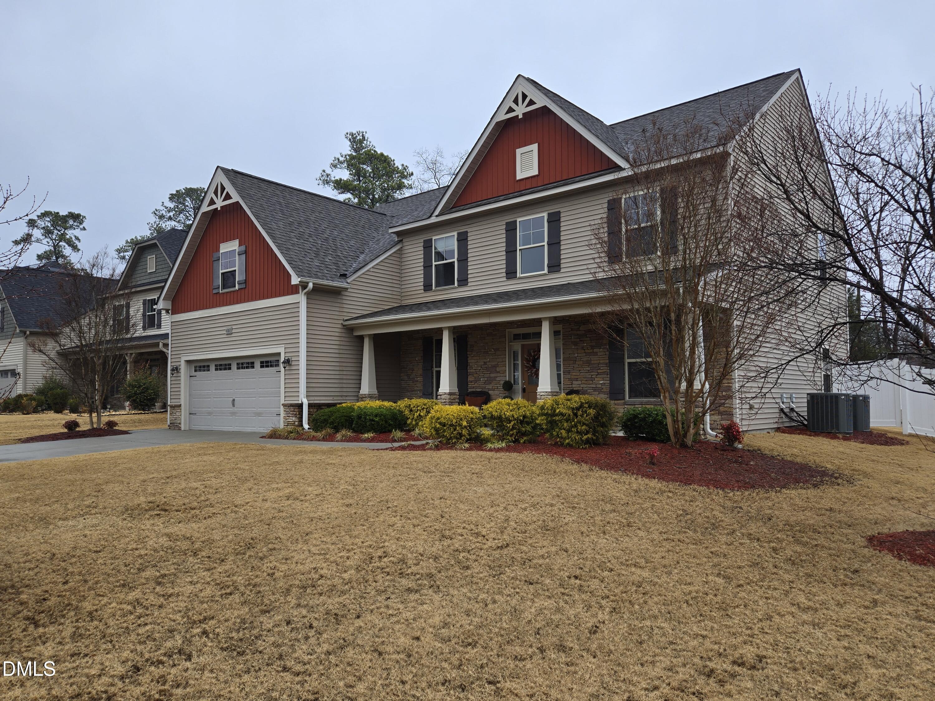 4202 Smithson Court Raleigh, NC 27616 - Photo 49 of 54 a front view of a house with a yard
