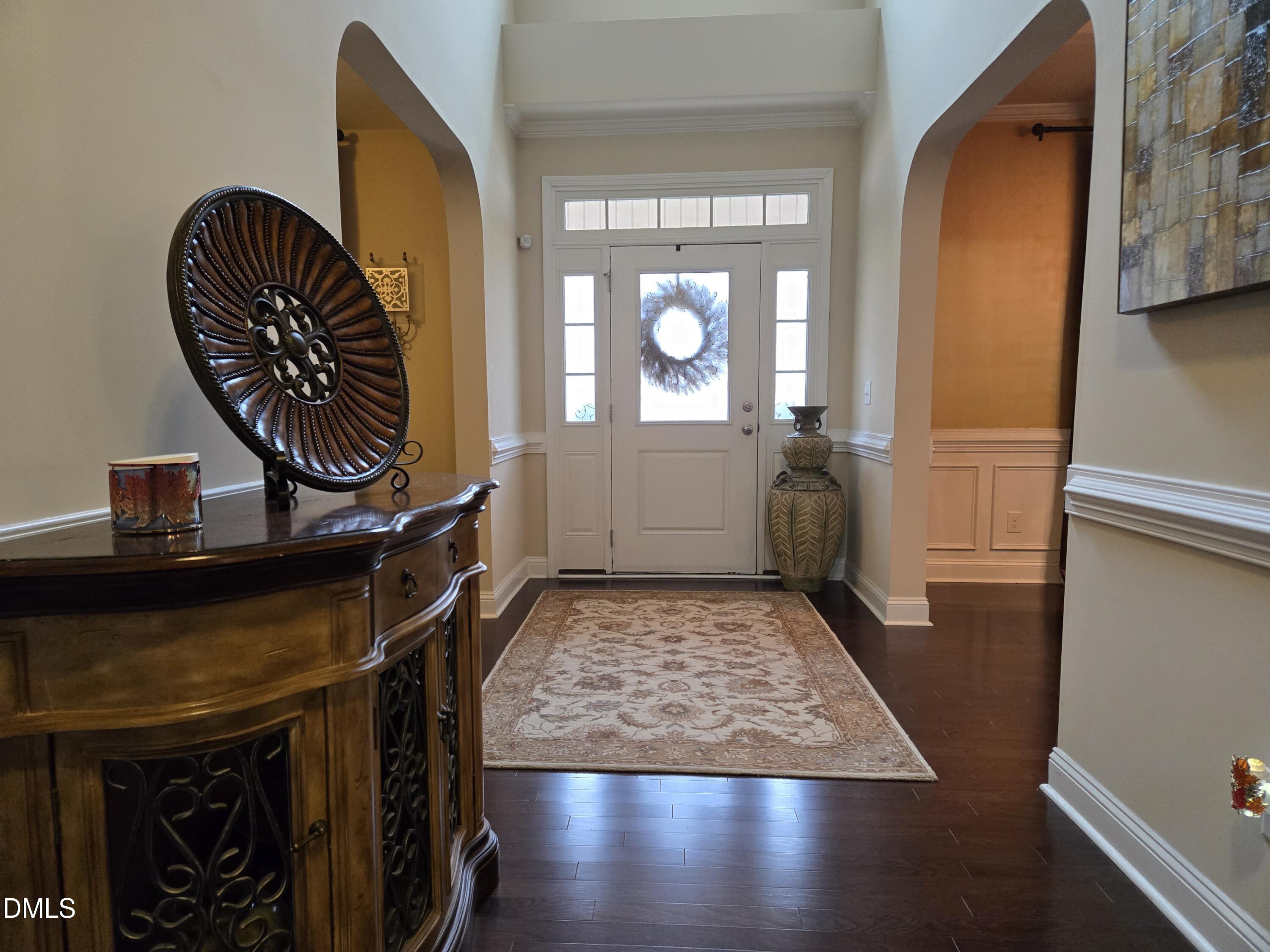 4202 Smithson Court Raleigh, NC 27616 - Photo 5 of 54 a view of a entryway door with wooden floor