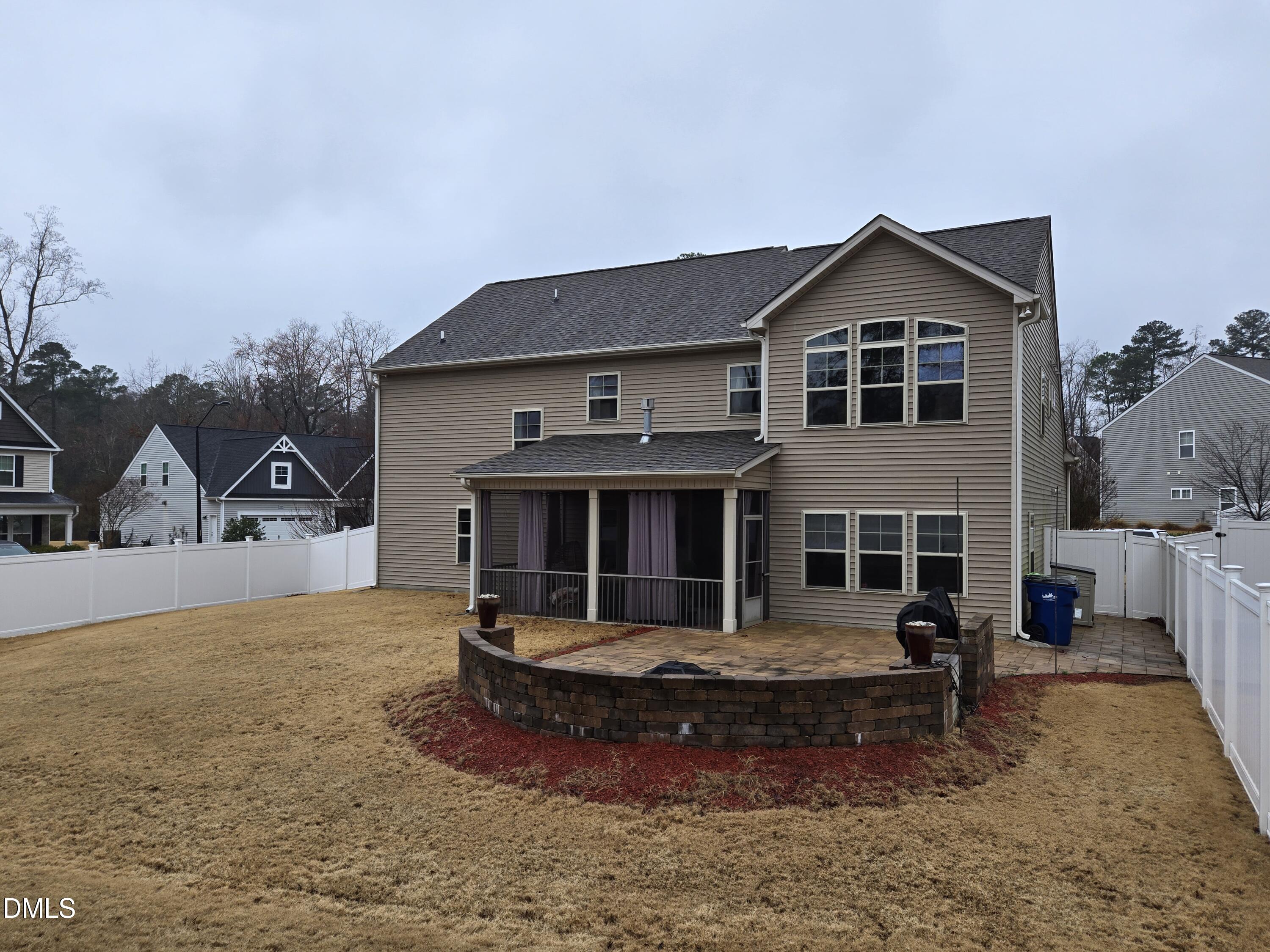 4202 Smithson Court Raleigh, NC 27616 - Photo 54 of 54 a front view of a house with a yard garage and outdoor seating