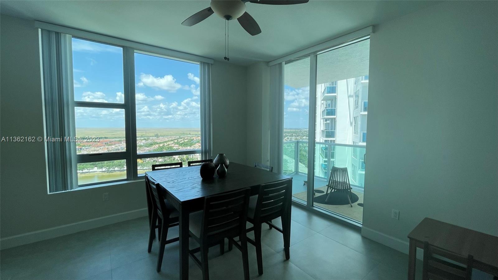 2681 North Flamingo Road, Unit 2408S Sunrise, FL 33323 - Photo 14 of 57 a view of a dining room with furniture window and outside view