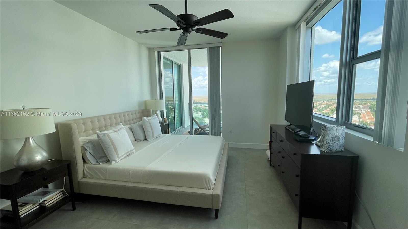 2681 North Flamingo Road, Unit 2408S Sunrise, FL 33323 - Photo 16 of 57 a living room with furniture and a flat screen tv