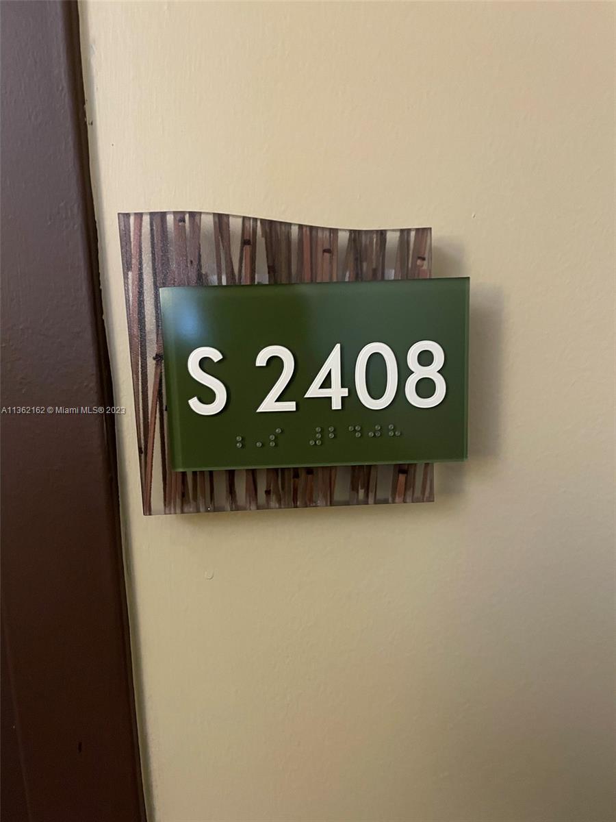 2681 North Flamingo Road, Unit 2408S Sunrise, FL 33323 - Photo 2 of 57 a close up of a sign board