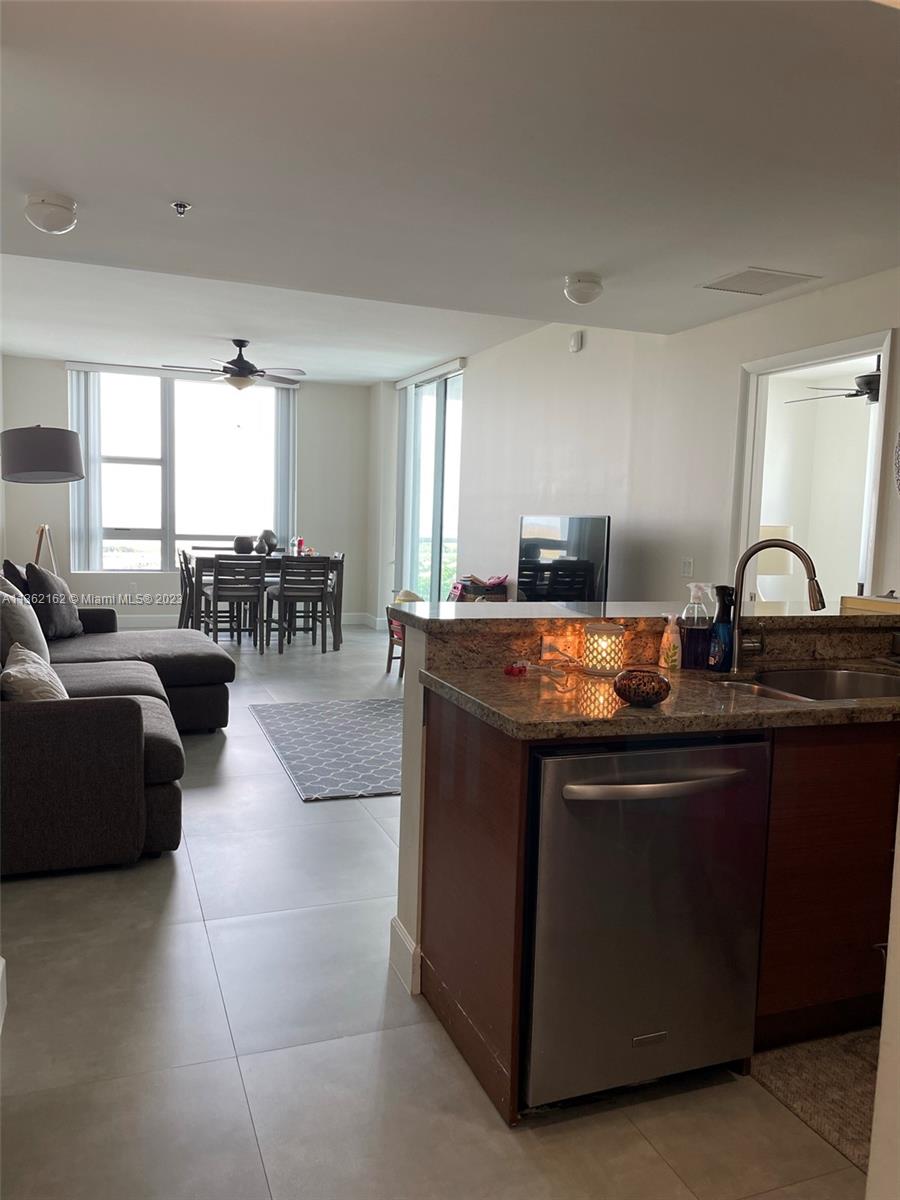 2681 North Flamingo Road, Unit 2408S Sunrise, FL 33323 - Photo 21 of 57 a kitchen with a sink and cabinets