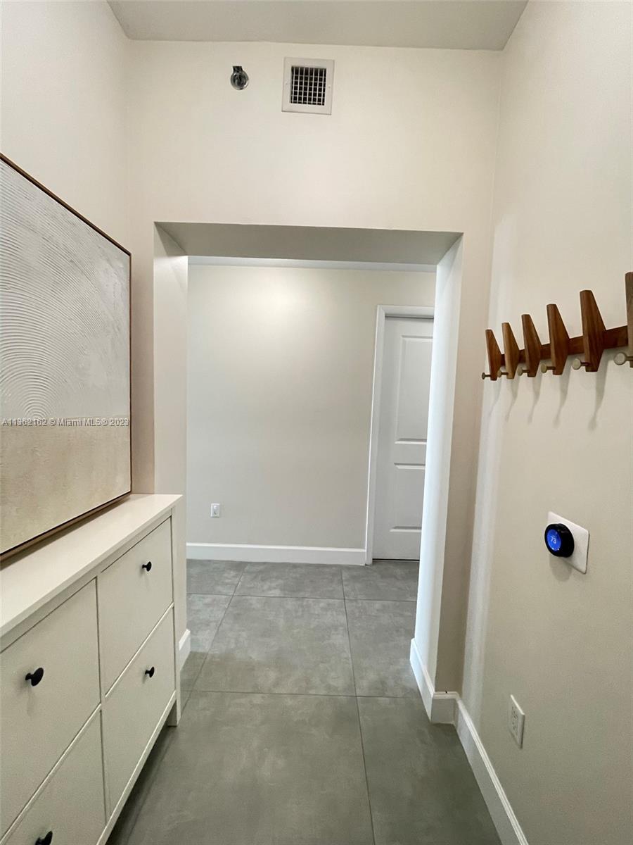 2681 North Flamingo Road, Unit 2408S Sunrise, FL 33323 - Photo 22 of 57 a bathroom with a shower and a mirror