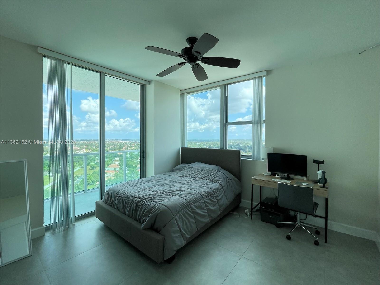 2681 North Flamingo Road, Unit 2408S Sunrise, FL 33323 - Photo 28 of 57 a bedroom with a bed and a window