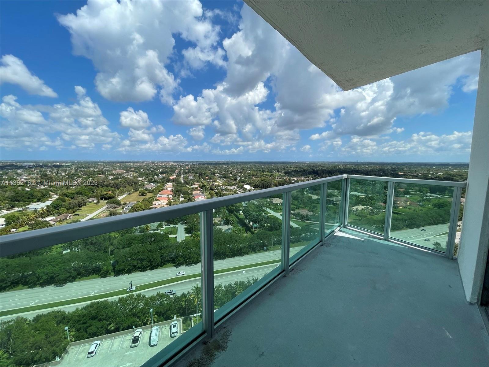 2681 North Flamingo Road, Unit 2408S Sunrise, FL 33323 - Photo 29 of 57 a view of a yard with wooden fence