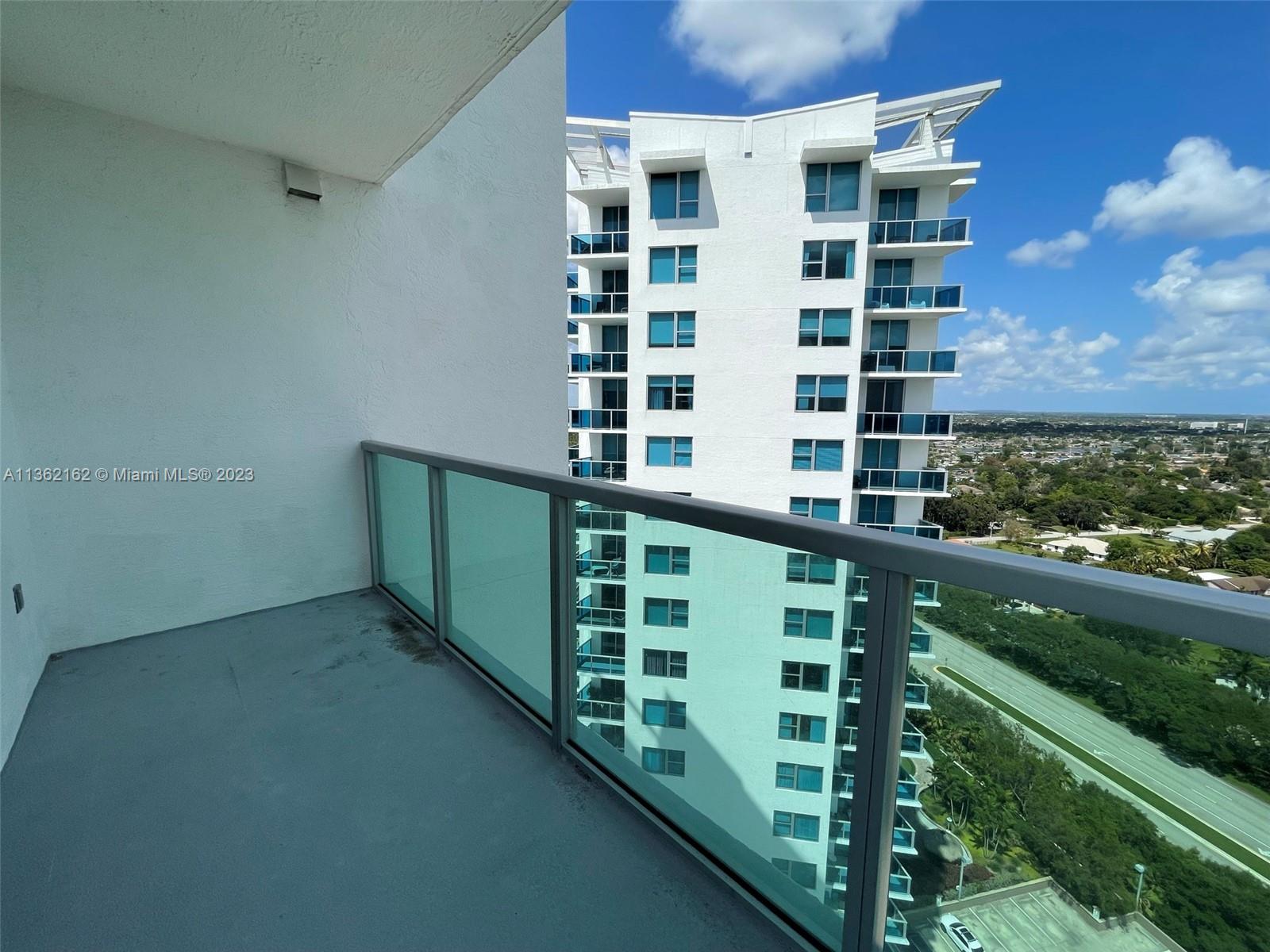 2681 North Flamingo Road, Unit 2408S Sunrise, FL 33323 - Photo 33 of 57 a view of a balcony with a green space