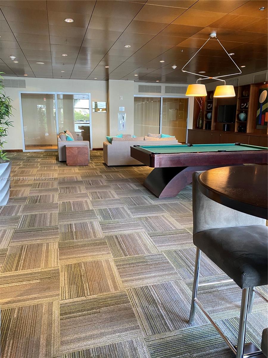 2681 North Flamingo Road, Unit 2408S Sunrise, FL 33323 - Photo 36 of 57 a room with lots of tables and chairs