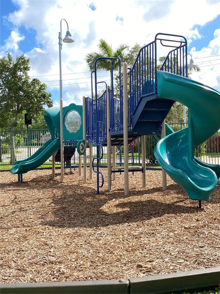 2681 North Flamingo Road, Unit 2408S Sunrise, FL 33323 - Photo 48 of 57 a front view of a house with garden