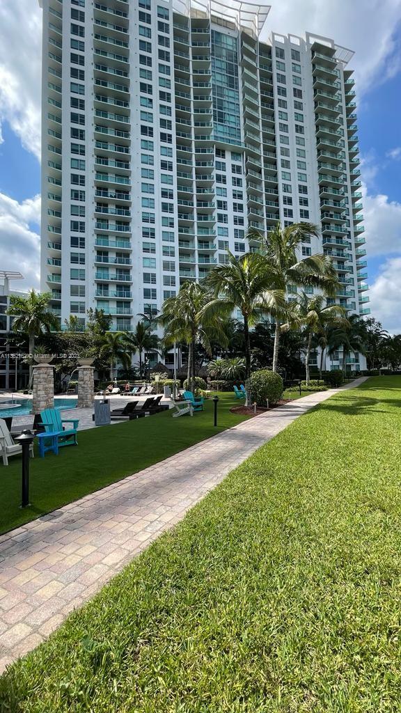 2681 North Flamingo Road, Unit 2408S Sunrise, FL 33323 - Photo 54 of 57 a front view of a building with garden