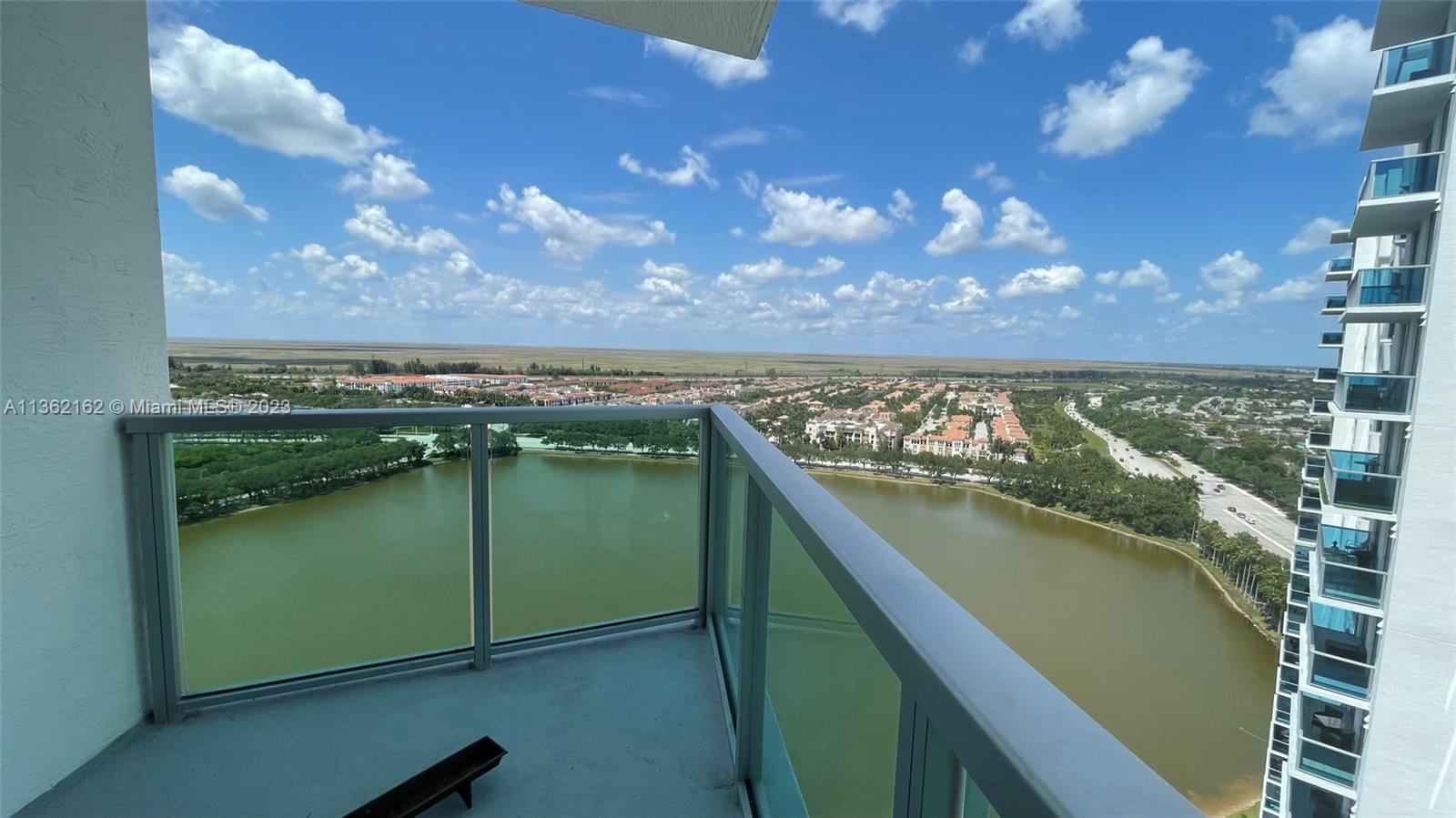 2681 North Flamingo Road, Unit 2408S Sunrise, FL 33323 - Photo 7 of 57 a view of a lake from a balcony