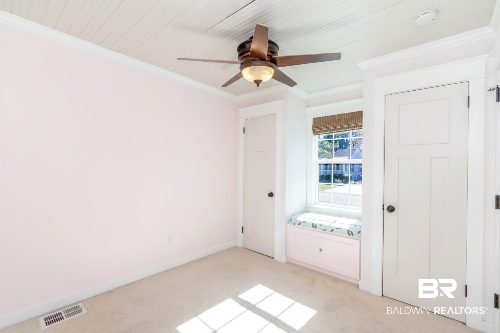 10 South Hathaway Road Mobile, AL 36608 - Photo 19 of 46 Unfurnished bedroom featuring ornamental molding, light carpet, a ceiling fan, and two closets