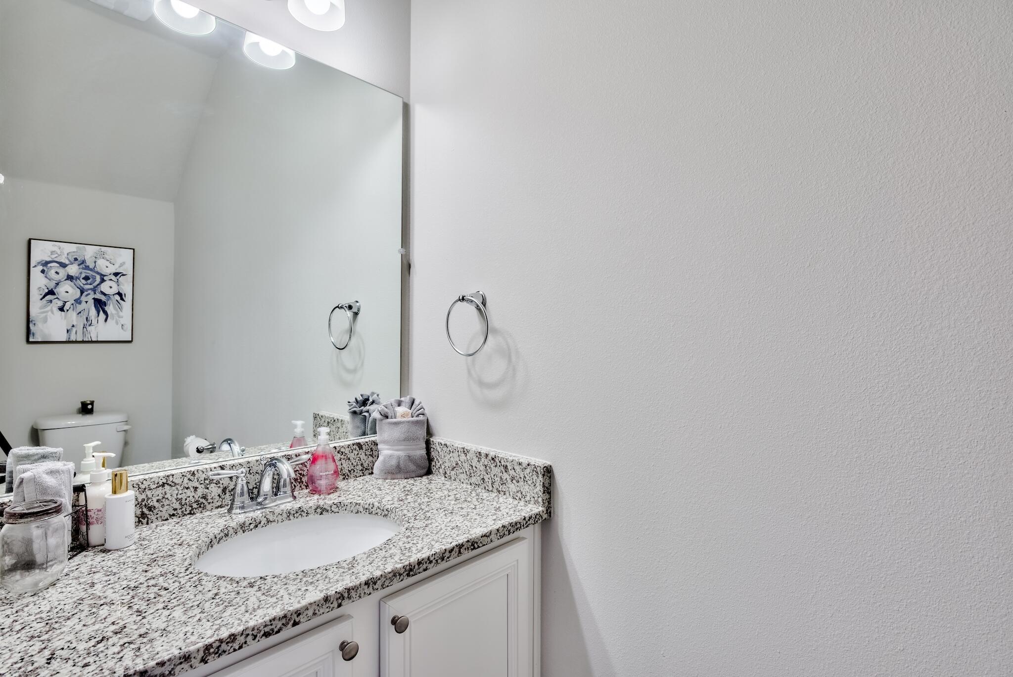 89 Crossing Lane, Unit C Santa Rosa Beach, FL 32459 - Photo 13 of 27 a bathroom with a granite countertop sink and a mirror
