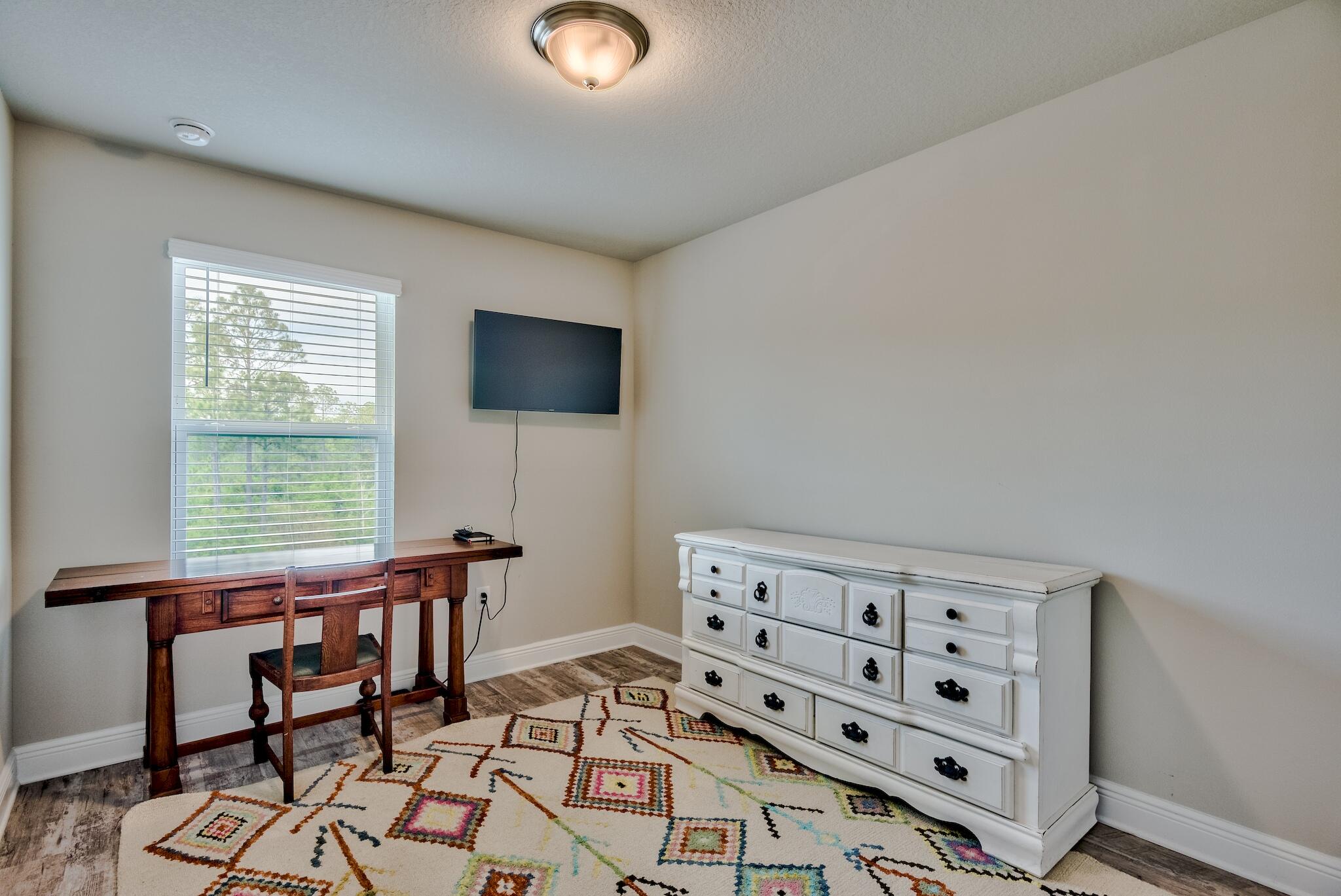 89 Crossing Lane, Unit C Santa Rosa Beach, FL 32459 - Photo 15 of 27 a view of a workspace with furniture and a window