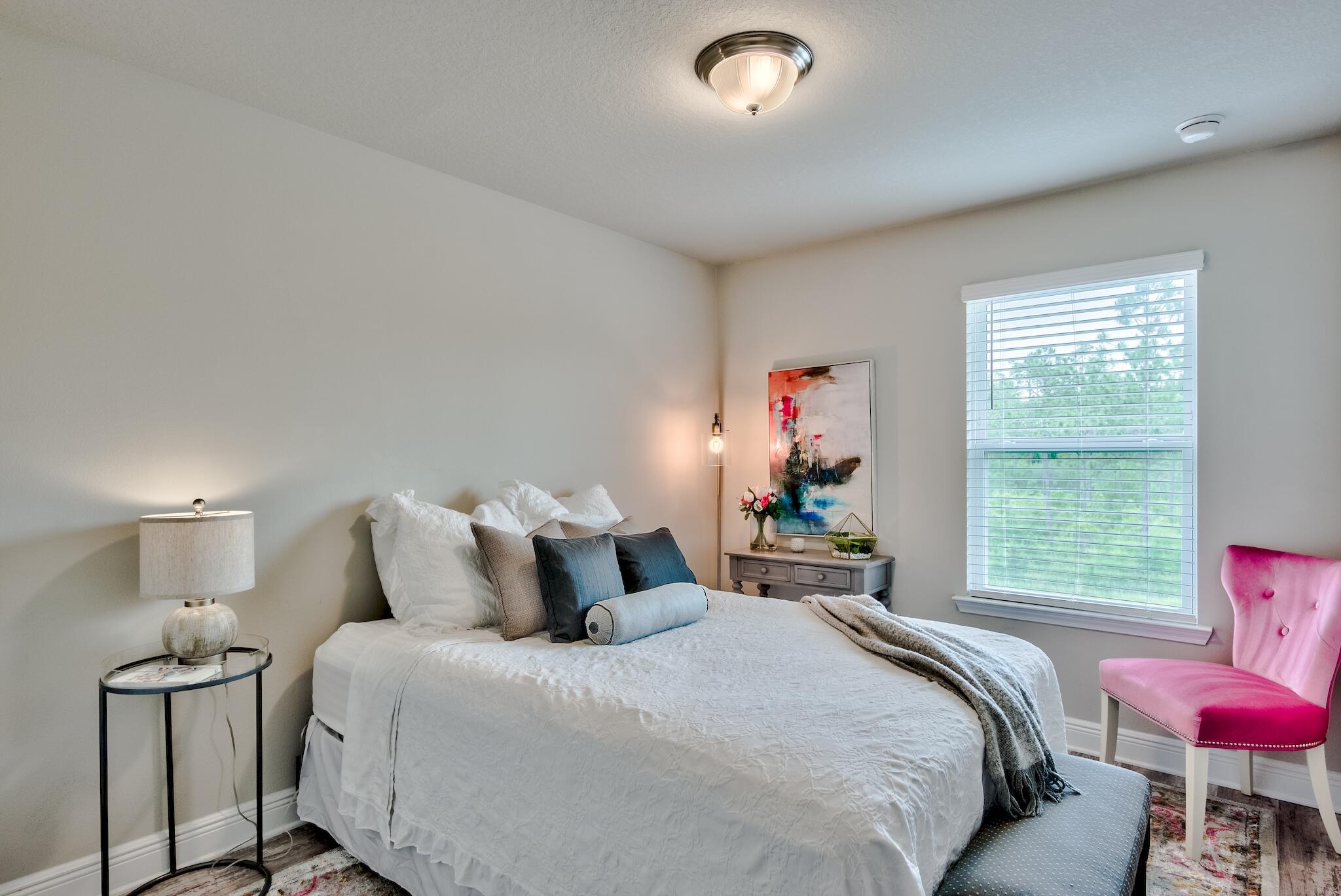 89 Crossing Lane, Unit C Santa Rosa Beach, FL 32459 - Photo 17 of 27 a bedroom with a bed and window