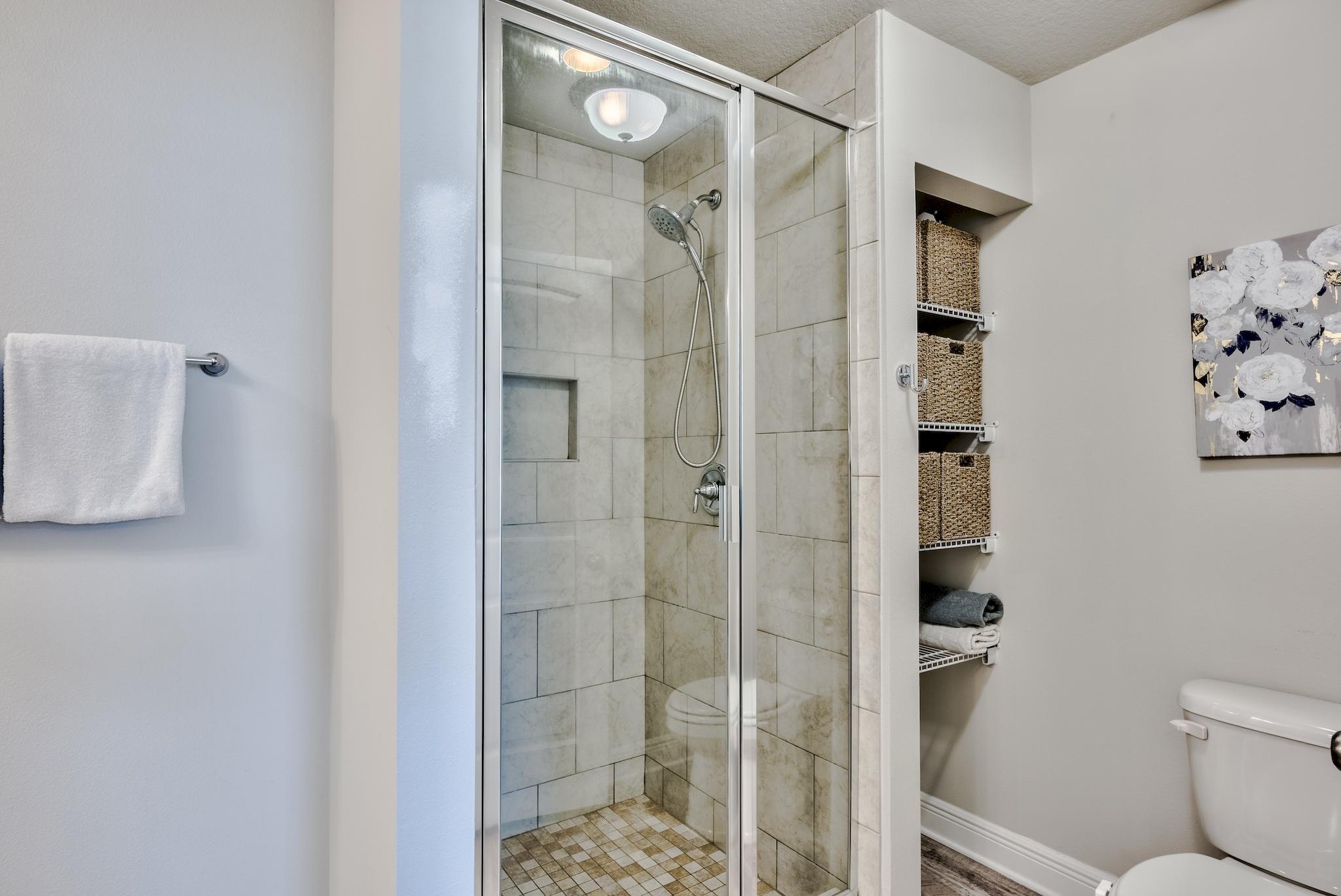 89 Crossing Lane, Unit C Santa Rosa Beach, FL 32459 - Photo 24 of 27 a bathroom with a shower and a toilet