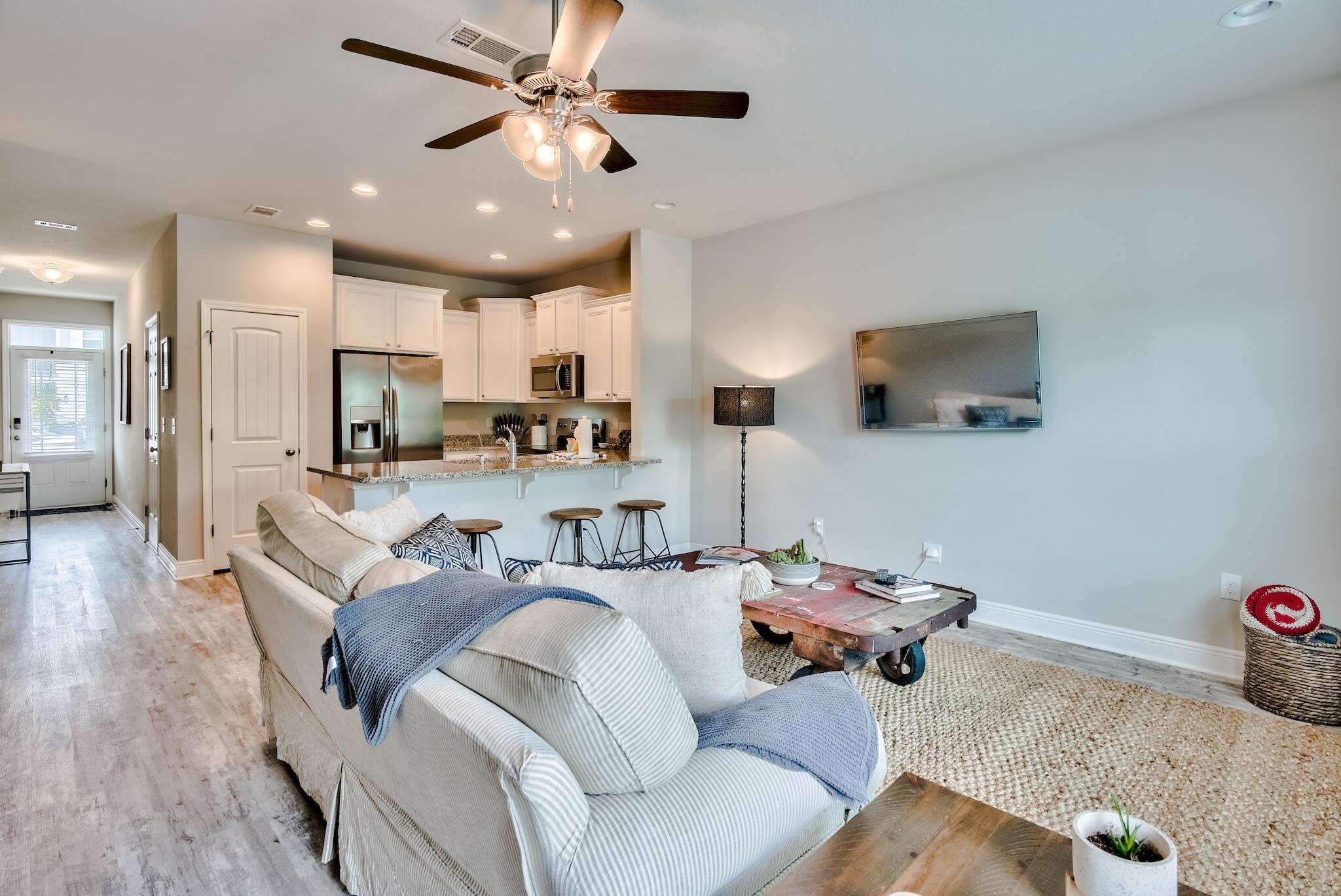 89 Crossing Lane, Unit C Santa Rosa Beach, FL 32459 - Photo 7 of 27 a living room with furniture and a wooden floor