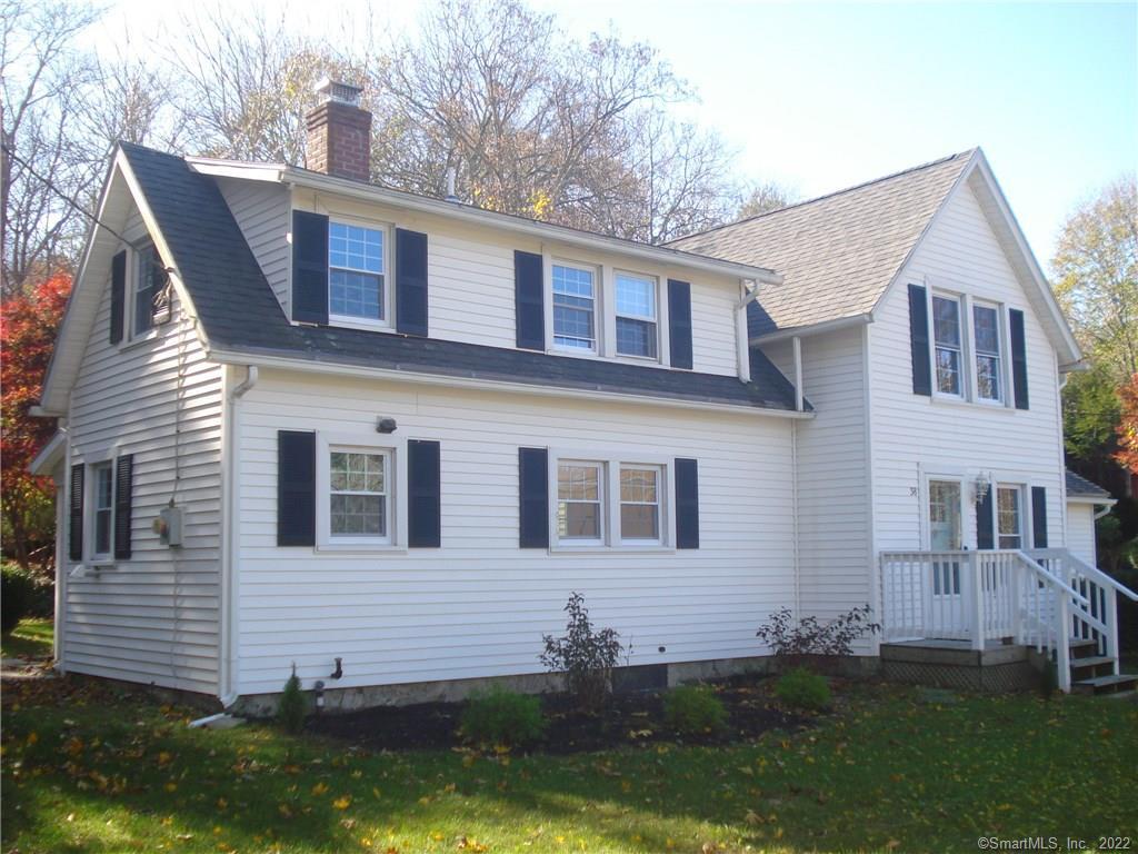 38 Roxbury Road East Lyme, CT 06357 - Photo 1 of 1 VIEW OF THE FRONT OF THE HOME SHOWING THE FRONT ENTRY TO LIVING ROOM AND KICHEN, LAUNDRY, AND MUDROOM WING TO THE RIGHT.
