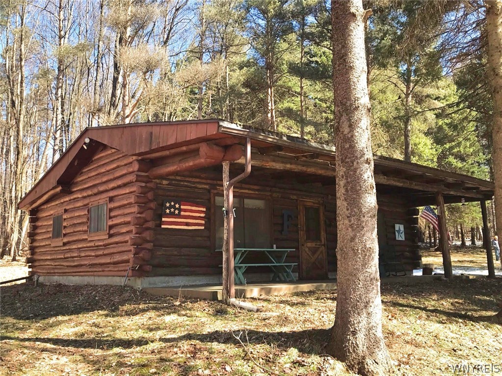 11633 Cadwell Road Centerville, NY 14024 - Photo 1 of 1 Beautiful 3 bedroom log cabin with covered front p