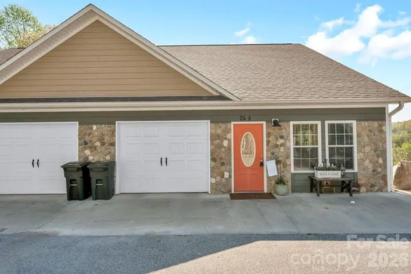 a front view of a house with outdoor space