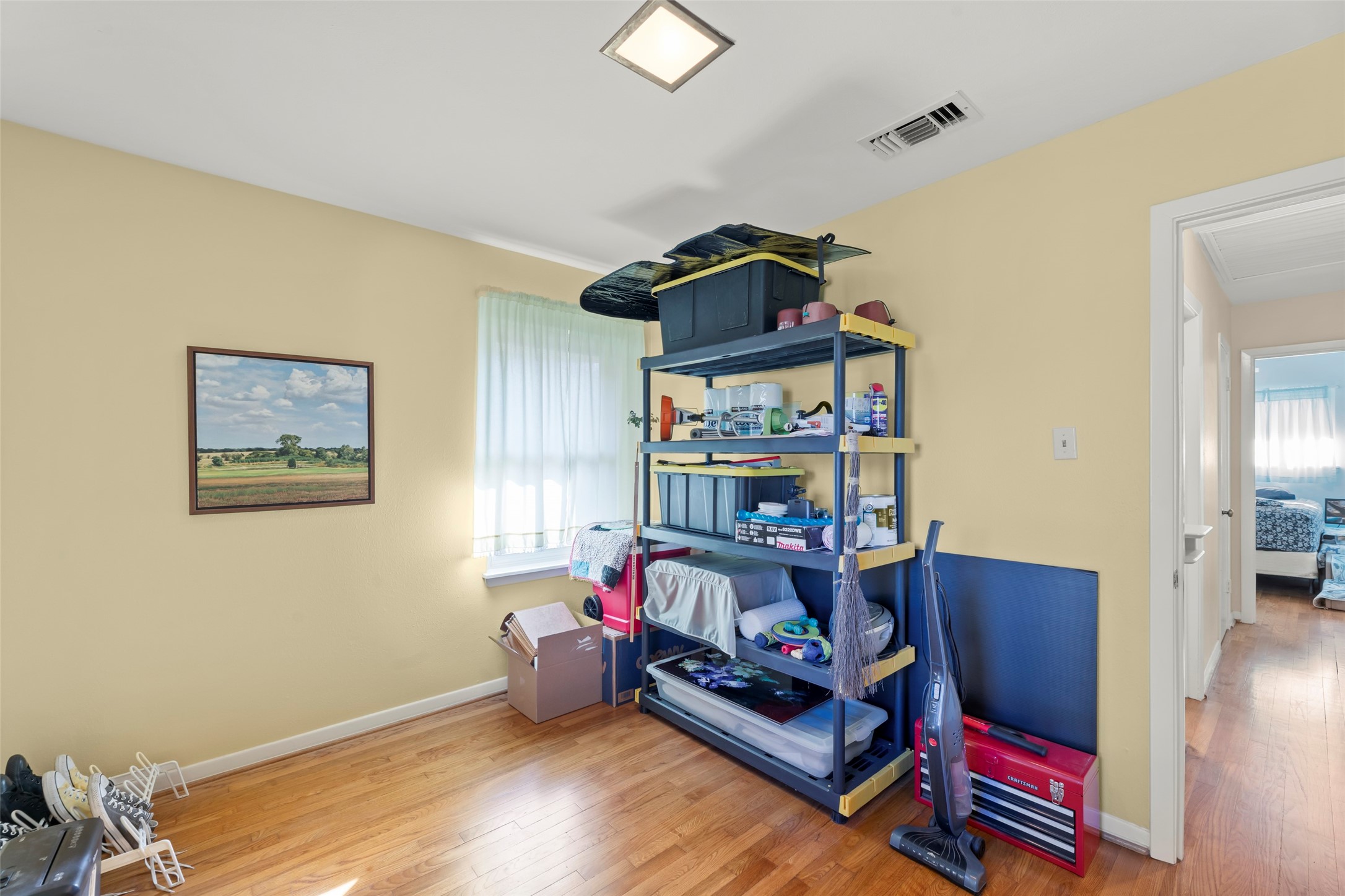 6834 Leader Street Houston, TX 77074 - Photo 12 of 20 a bedroom with furniture and a bed