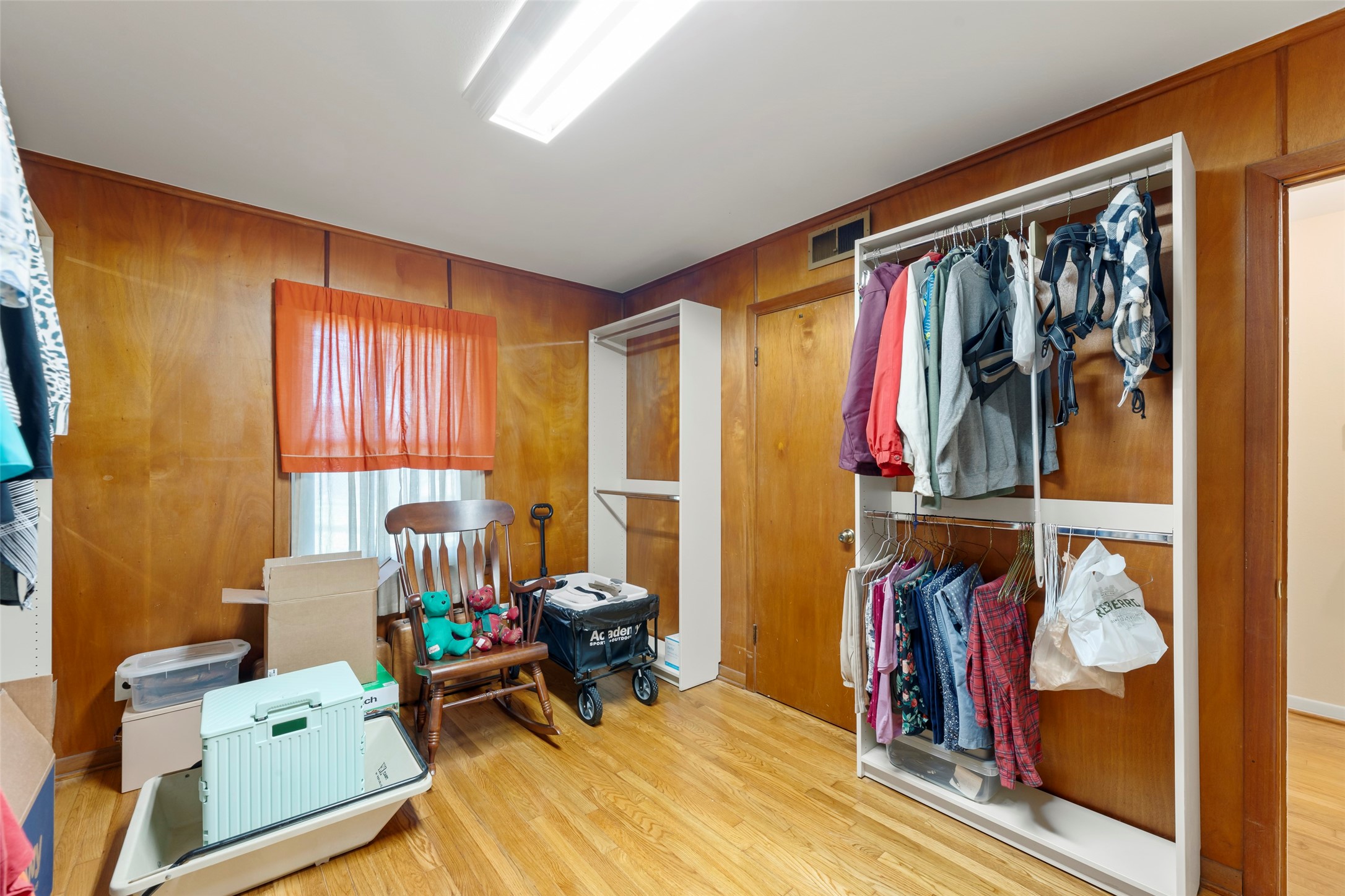 6834 Leader Street Houston, TX 77074 - Photo 14 of 20 a view of a room with furniture and clothes