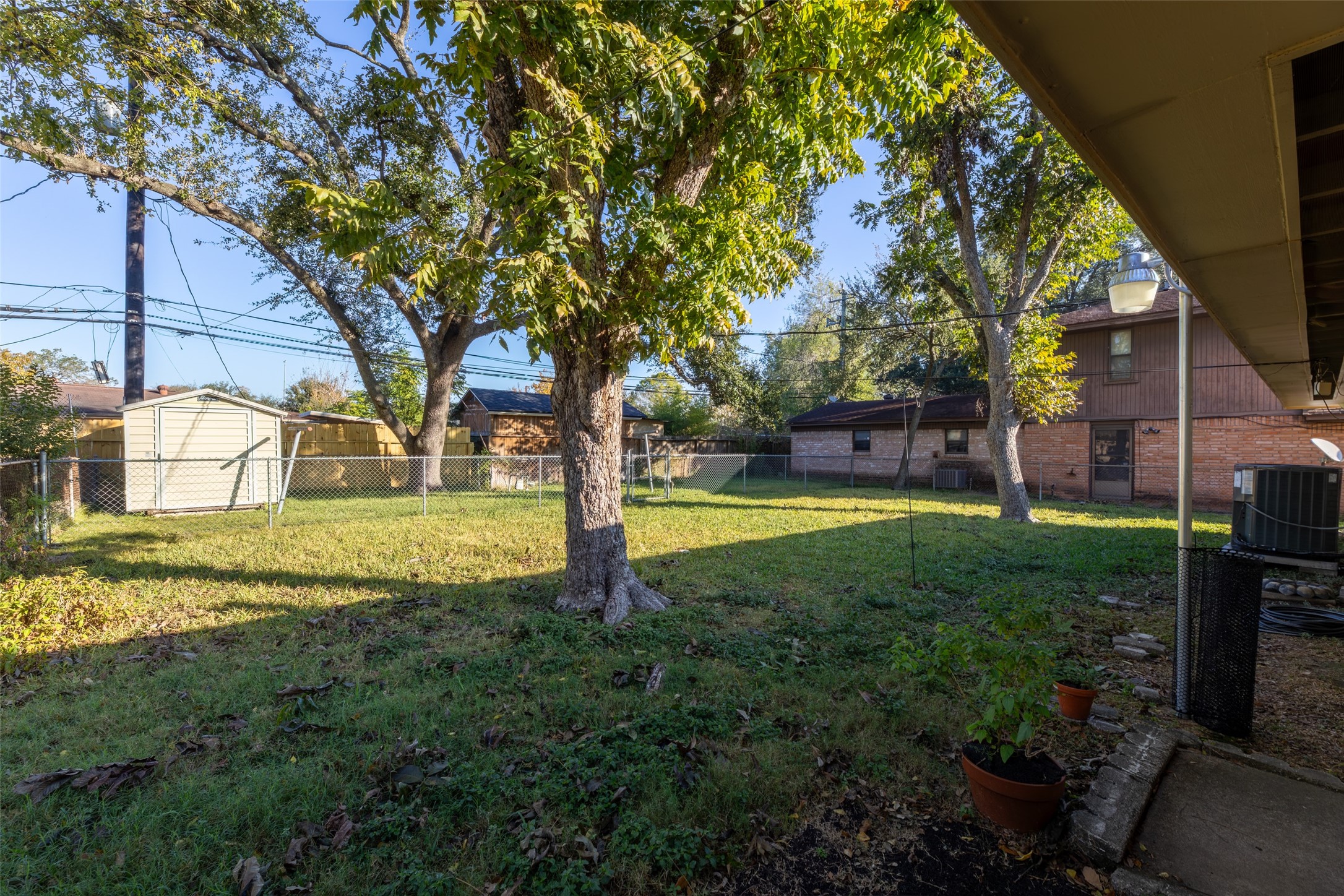 6834 Leader Street Houston, TX 77074 - Photo 19 of 20 a view of a house with a yard
