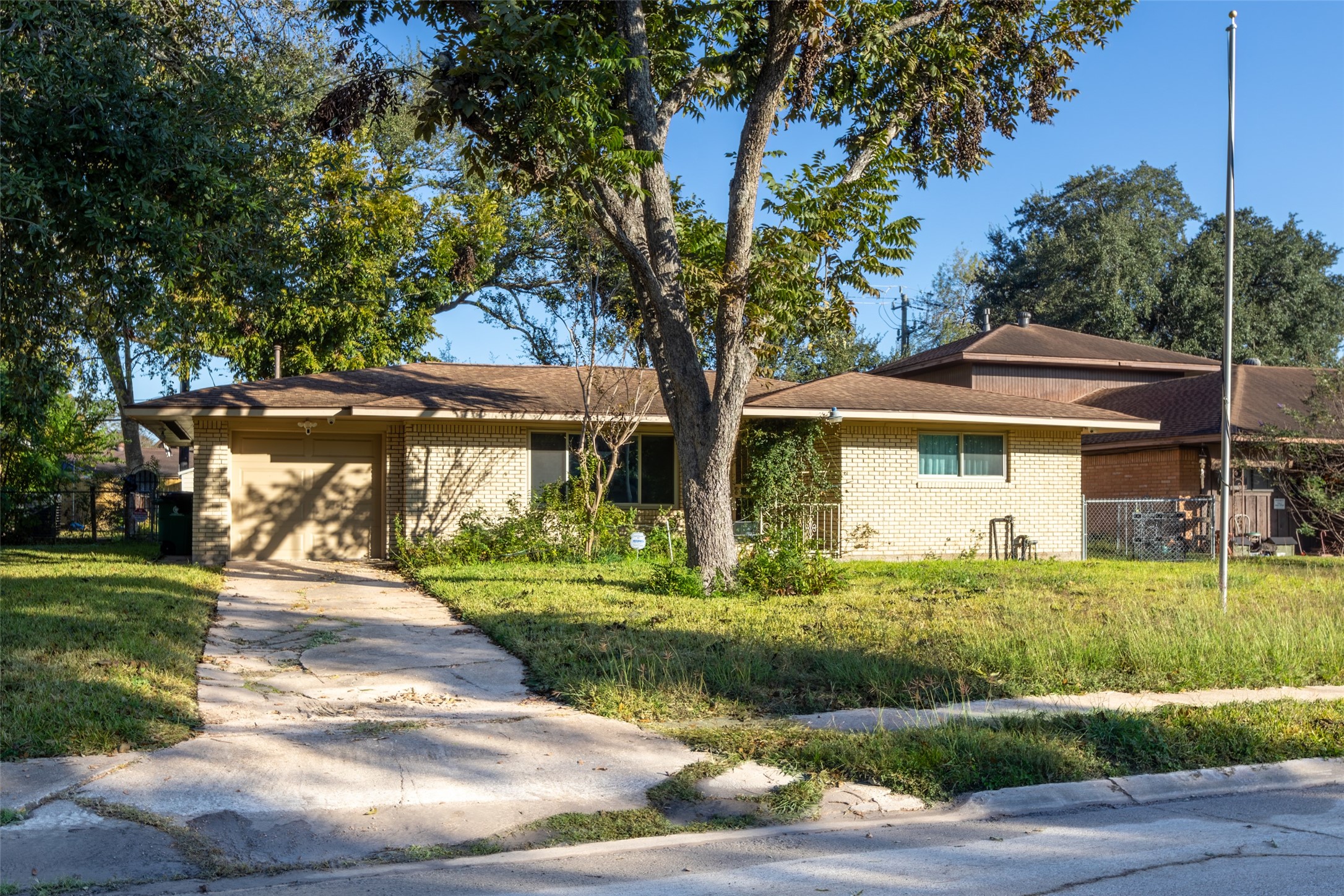 6834 Leader Street Houston, TX 77074 - Photo 2 of 20 a front view of a house with a yard