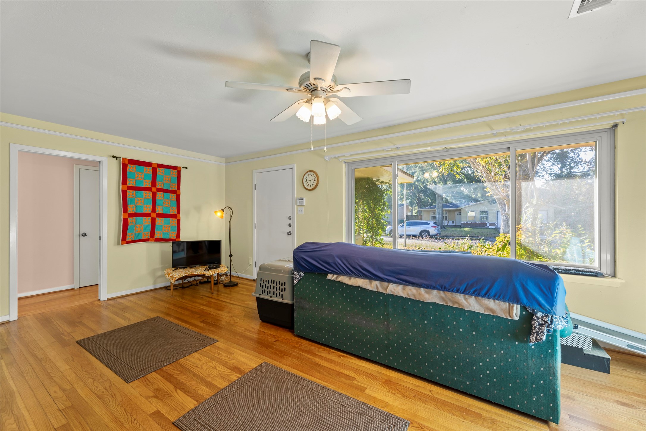 6834 Leader Street Houston, TX 77074 - Photo 5 of 20 a living room with a bed furniture and a large window