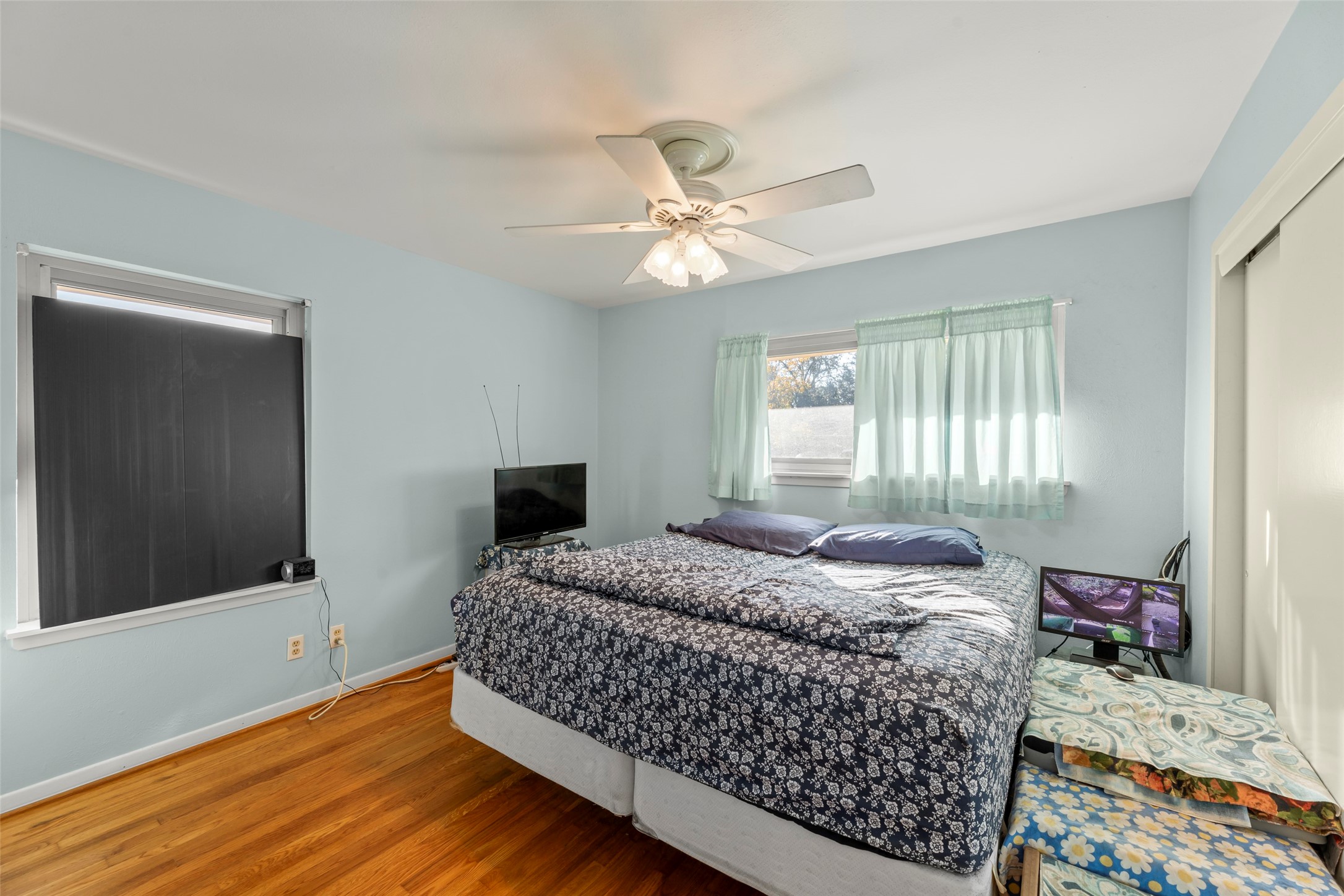 6834 Leader Street Houston, TX 77074 - Photo 6 of 20 a bedroom with a bed dresser and a window