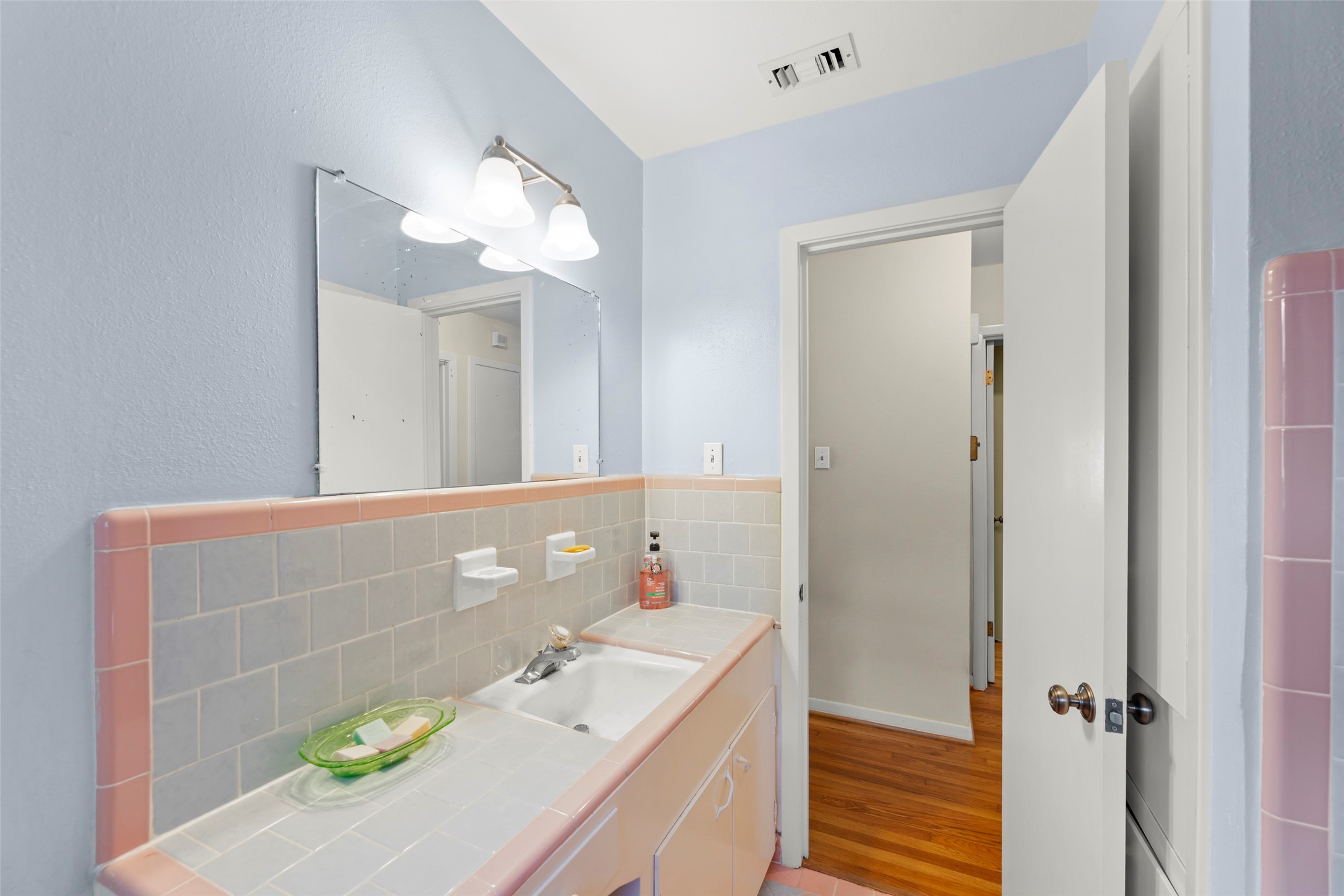6834 Leader Street Houston, TX 77074 - Photo 10 of 20 a bathroom with a sink vanity and a mirror