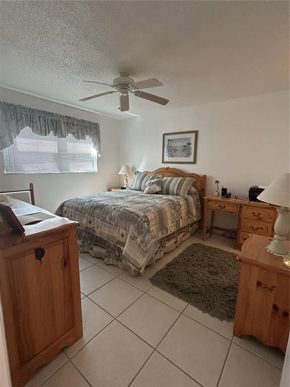 11485 Oakhurst Road, Unit 200318 Largo, FL 33774 - Photo 19 of 48 a bedroom with a bed and window