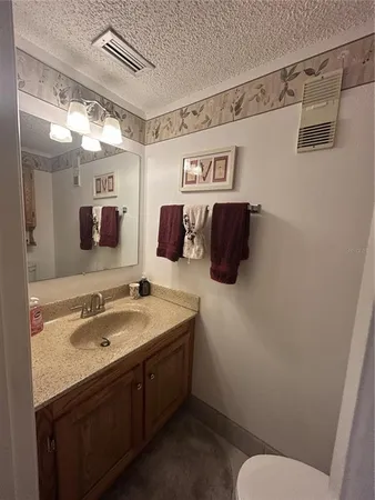 a bathroom with a sink and mirror