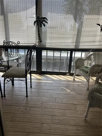 a view of a patio with table and chairs