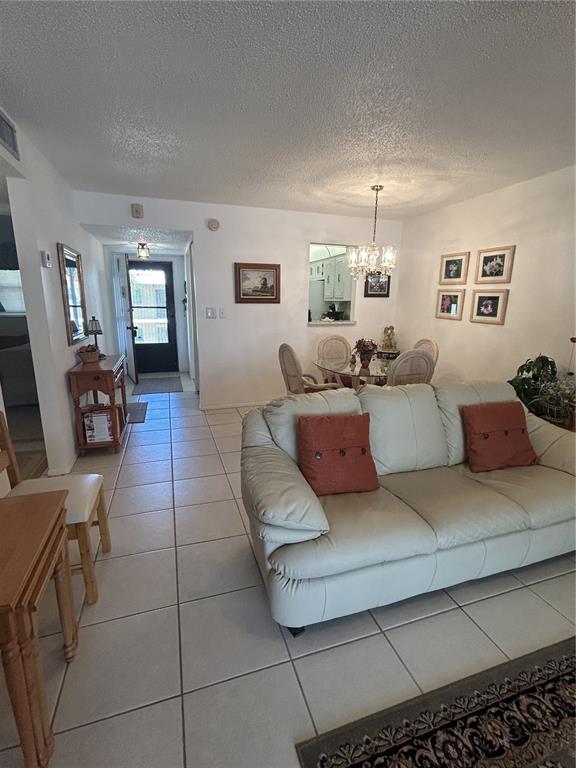 11485 Oakhurst Road, Unit 200318 Largo, FL 33774 - Photo 7 of 48 a living room with furniture and a window