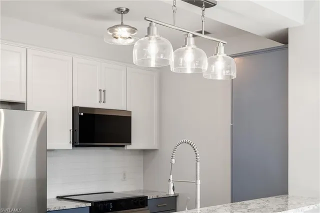 a bathroom with a sink a mirror and shower