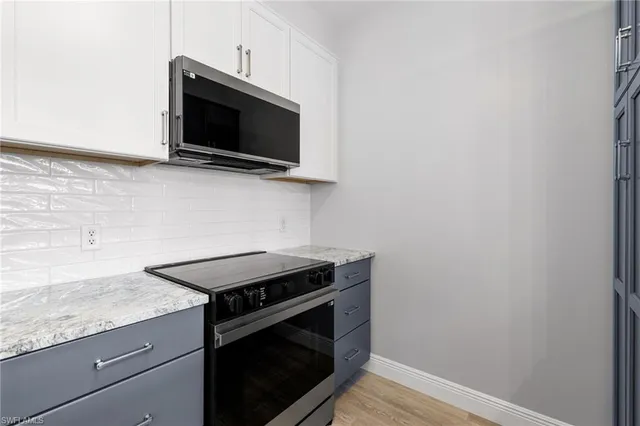 a kitchen with a stove and a microwave