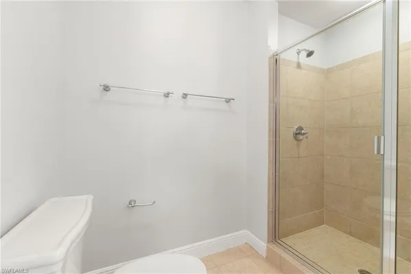 a bathroom with a shower and toilet