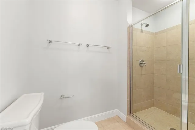 a bathroom with a shower and toilet