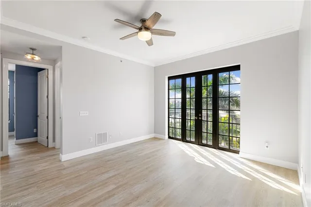 a view of an empty room with a window