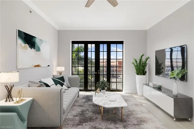 a living room with furniture and a potted plant