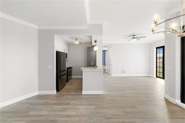a view of a living room with furniture and a flat screen tv