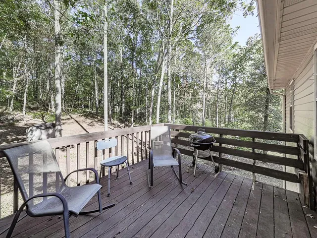 a view of a chairs in a wooden deck