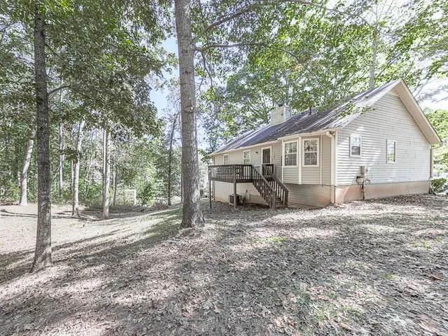 a view of a tree in front of a house
