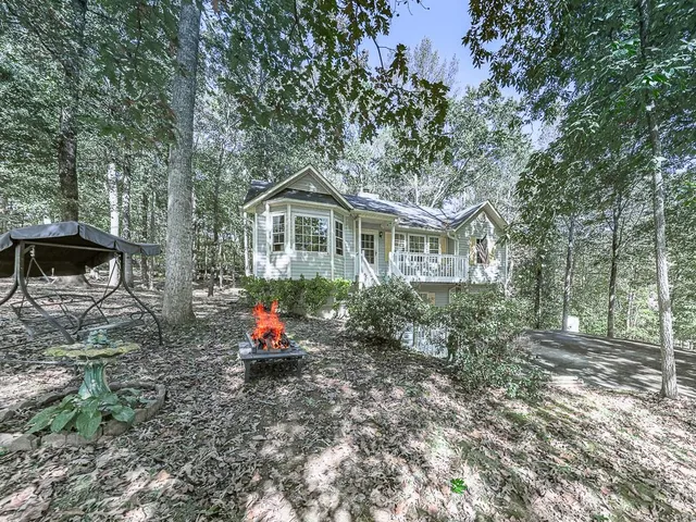 a backyard of a house with seating space