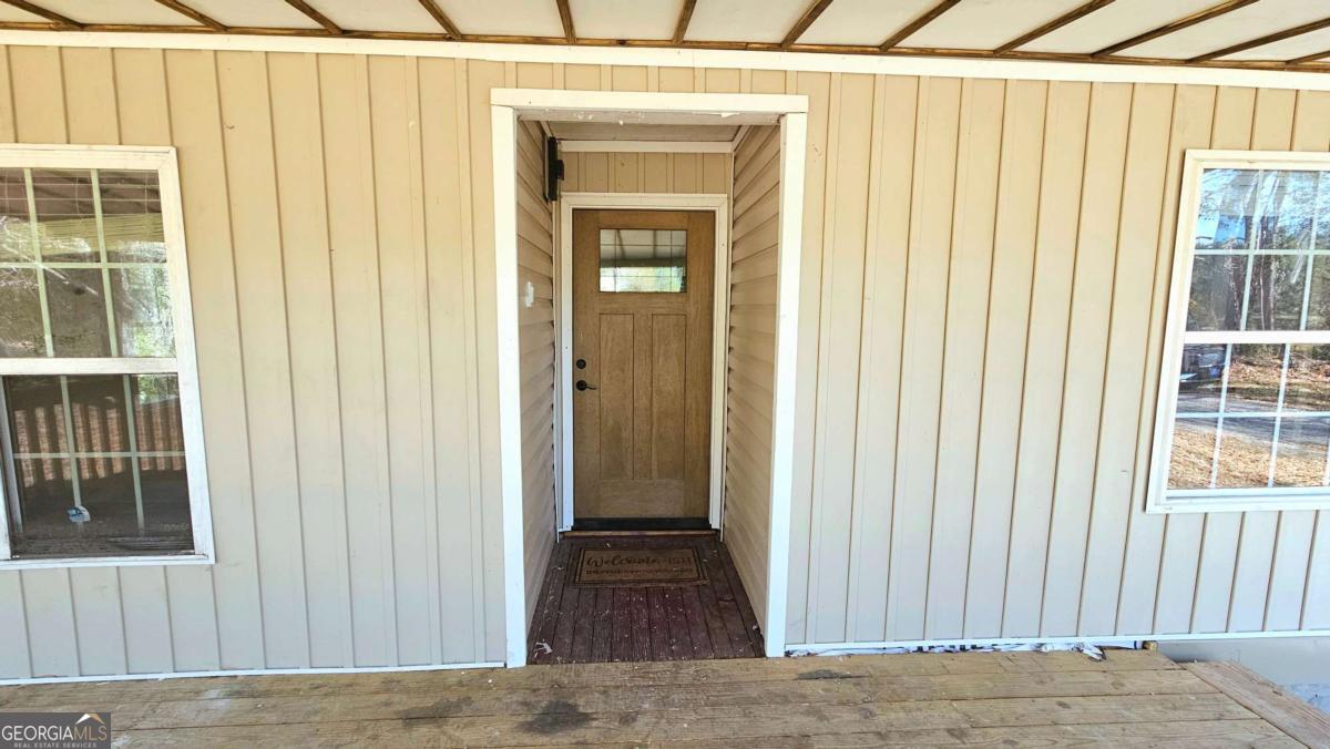 858 Augusta Road Valdosta, GA 31602 - Photo 5 of 28 a view of a entryway door with wooden floor