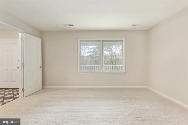 a view of a room with wooden walls