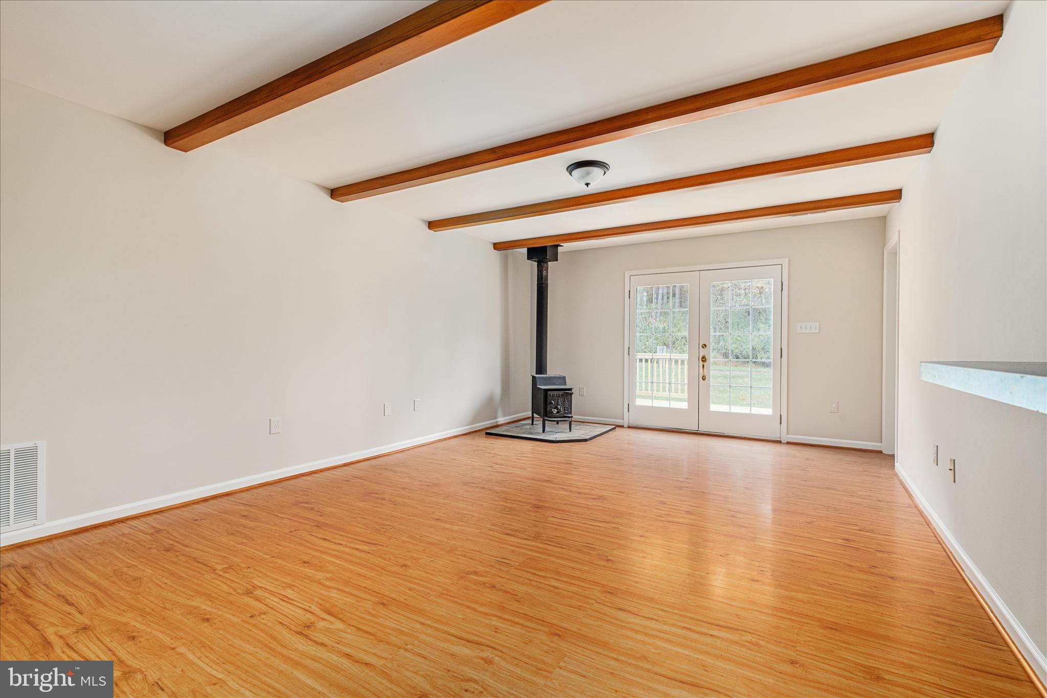 2983 Old Winchester Road Boyce, VA 22620 - Photo 49 of 91 a view of an empty room with wooden floor and a window